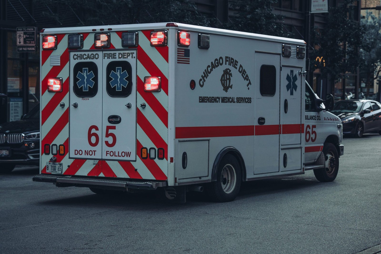 A Chicago Fire Department Ambulance on duty in urban city streets, showcasing emergency response vehicles.